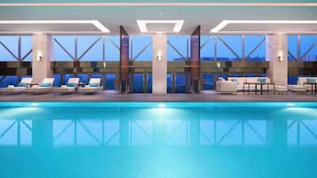 Indoor pool, open 9:00 AM to 9:00 PM, pool loungers