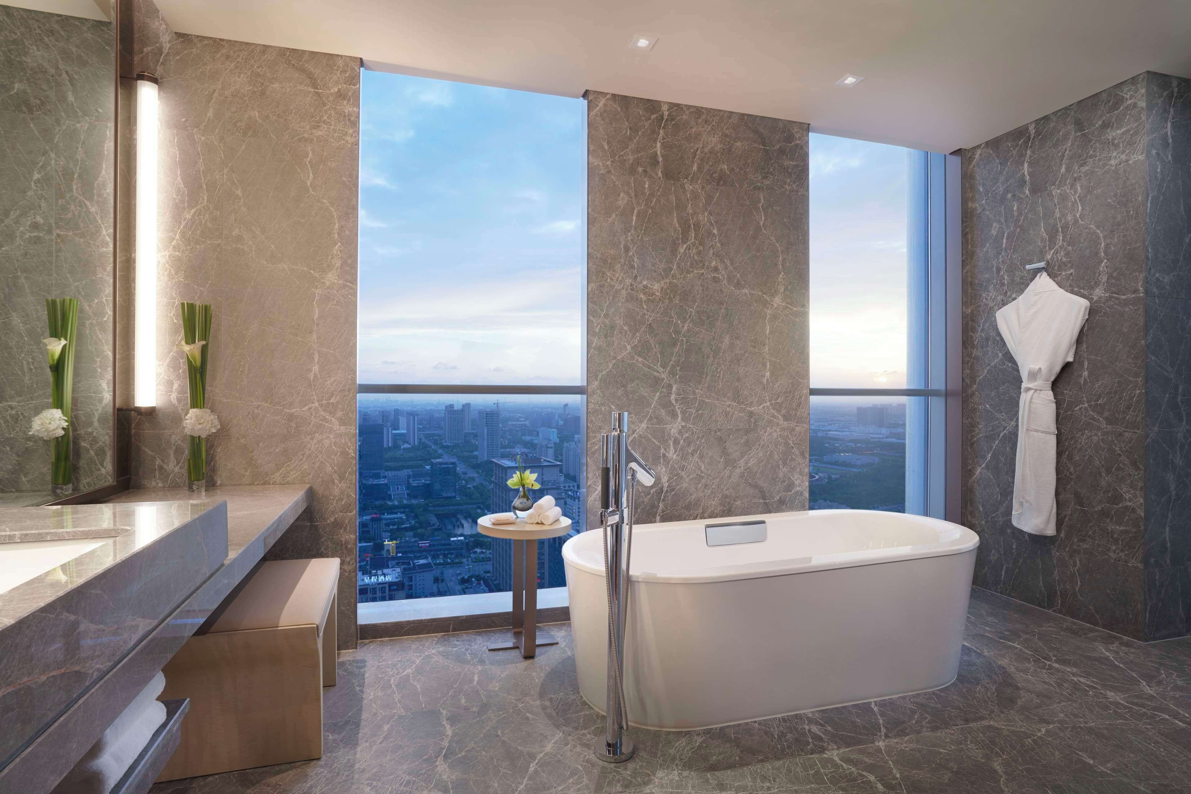 club room, 1 king bed (deluxe) | bathroom | designer toiletries, hair dryer, bathrobes, slippers