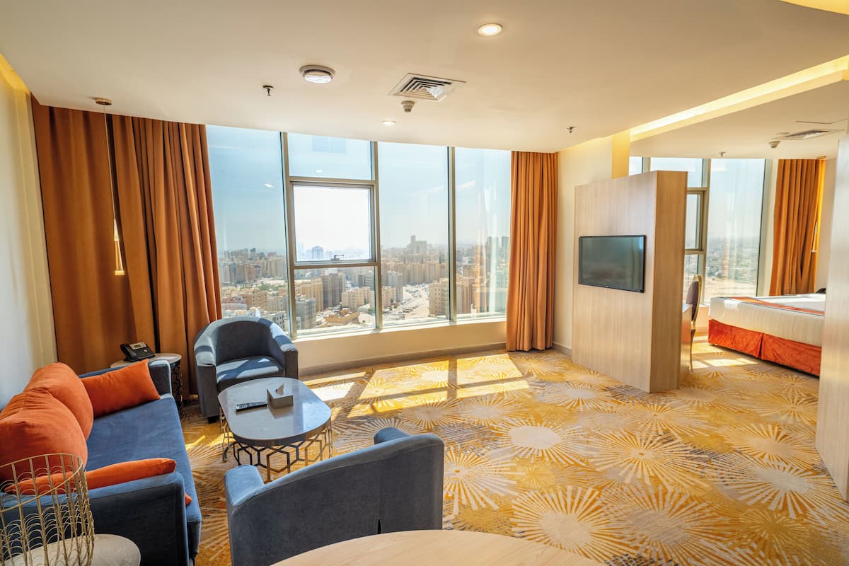 Suite exécutive, 1 chambre | Salle de séjour | Téléviseur connecté
