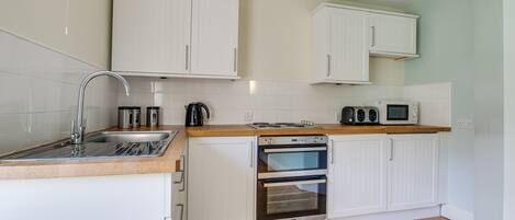 Fridge, microwave, oven, cookware/dishes/utensils
