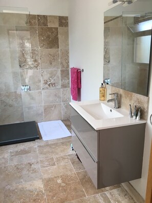 Bathtub, eco-friendly toiletries, hair dryer, towels