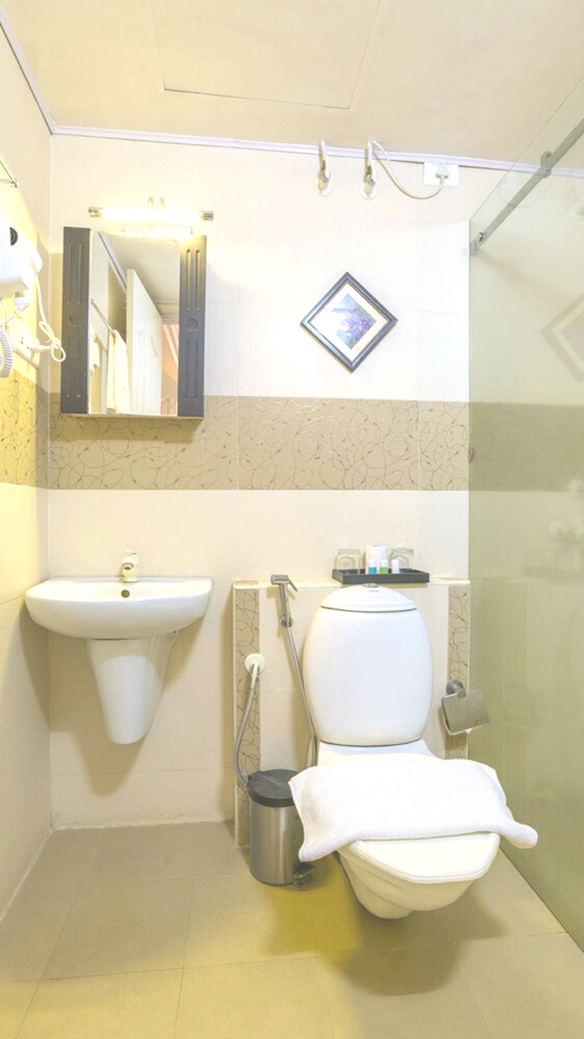 shower, rainfall showerhead, designer toiletries, hair dryer