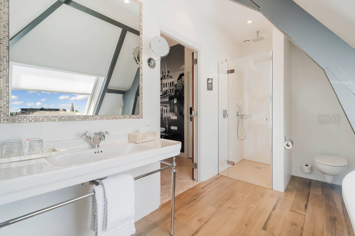 tower suite | bathroom | separate bathtub and shower, rainfall showerhead, hair dryer, towels