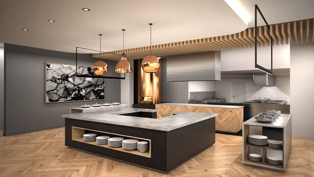 Uma cozinha moderna com uma ilha central, iluminação pendente e teto em padrão herringbone.