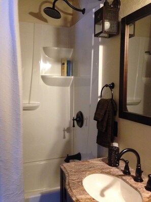 Combined shower/tub, hair dryer, towels, soap