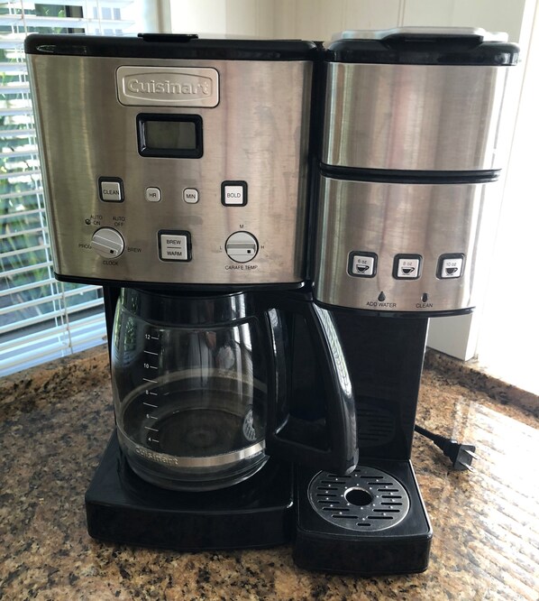 A Cuisinart coffee maker with a glass carafe and a drip tray. - Folly Vacation 620 apartment w/bonus room, one block to the beach & pet friendly (Folly Beach)