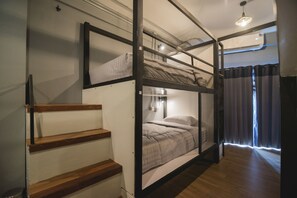 Premium bedding, desk, laptop workspace, blackout drapes