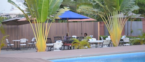 Outdoor pool, open 7 AM to 9:30 PM, pool umbrellas