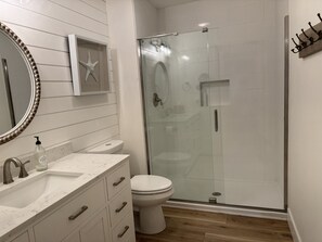 Combined shower/tub, hair dryer, towels, soap