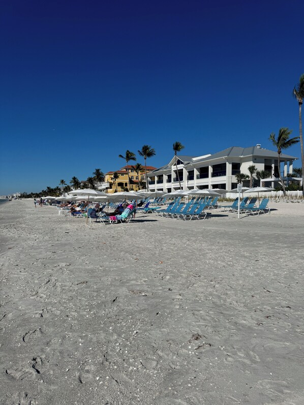 On the beach, sun loungers, beach towels