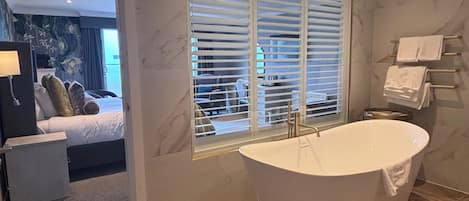 Panoramic Quadruple Room, Sea View | Bathroom | Hair dryer, towels, soap, shampoo