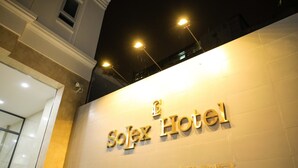 The exterior of the Solex Hotel with its name prominently displayed in gold lettering. - SoLex Hotel (Ho Chi Minh City)