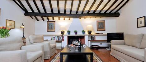 Departamento, 1 habitación | Área de sala de estar | Televisión de pantalla plana