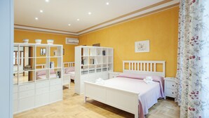 A bedroom with a bed, a wardrobe, and a nightstand. - Bufalo - WR Apartments (Rome)