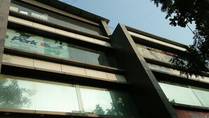 A multi-story building with signage for 'Perk Bathing Accessories' and 'Danube'. - Hotel Alfa International (Mumbai)