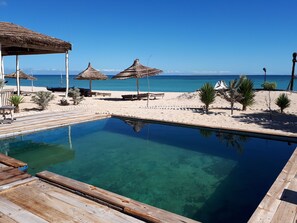Outdoor pool, pool umbrellas, sun loungers