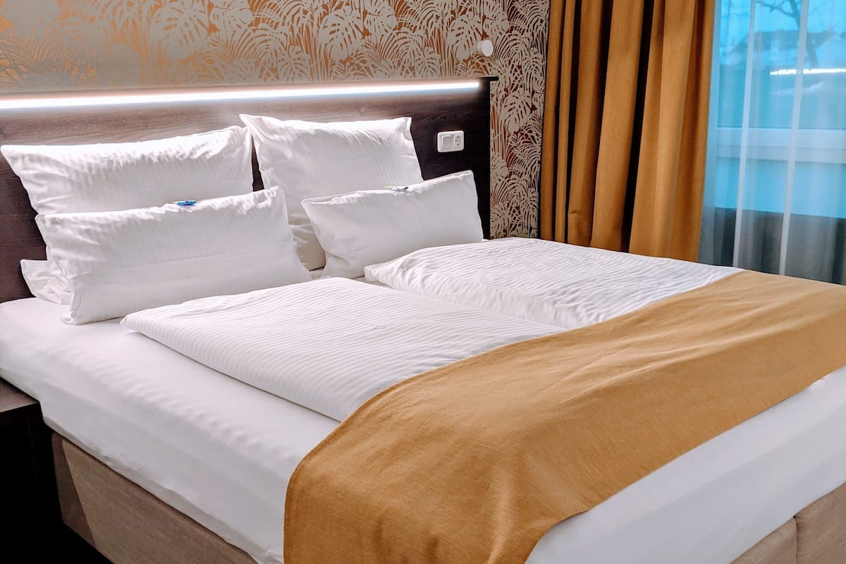 hypo-allergenic bedding, in-room safe, desk, blackout curtains