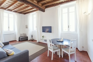 Apartment, 1 Bedroom | Living room | Flat-screen TV