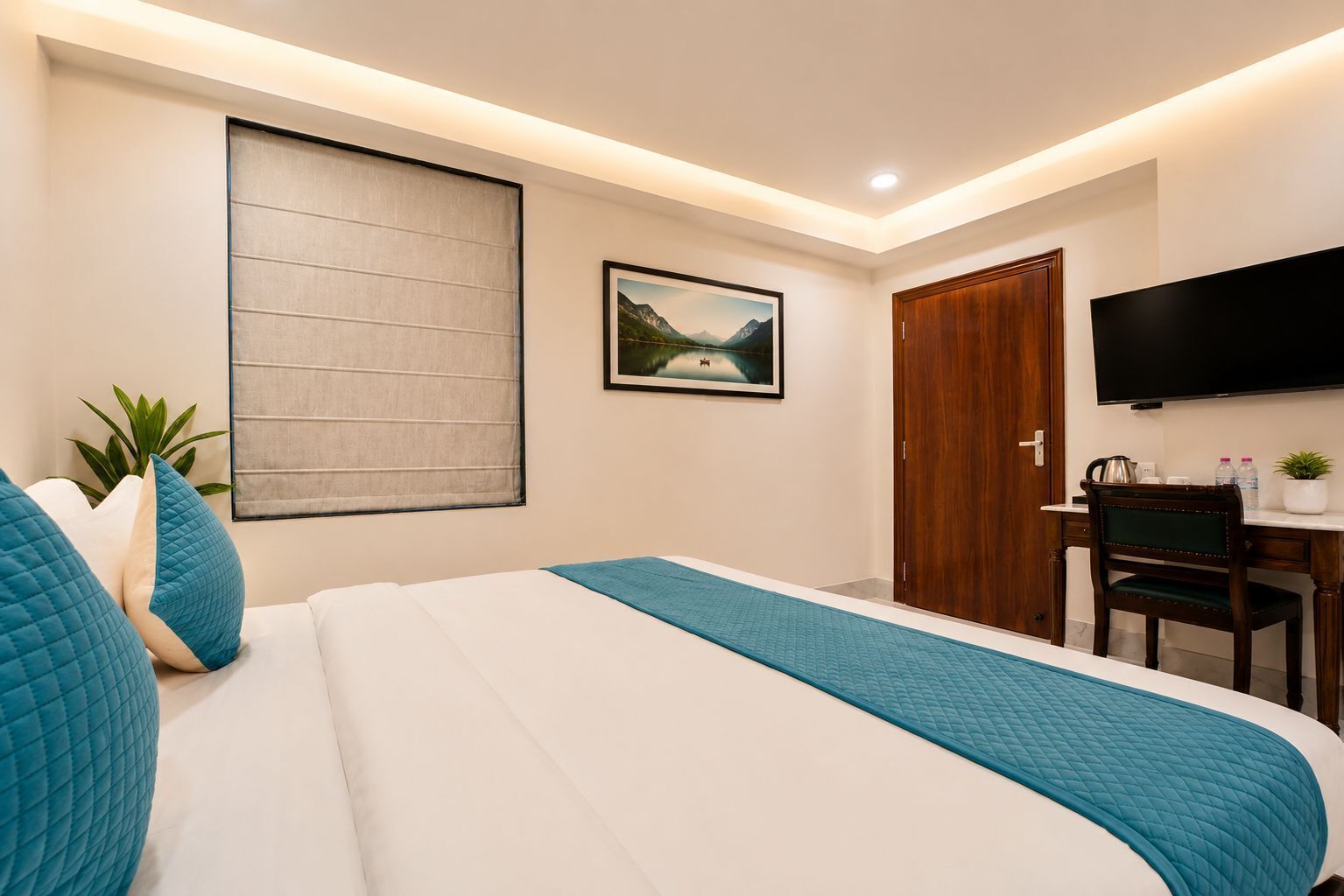 A hotel room with a bed, a desk, a television, a window with a view, and a door.
