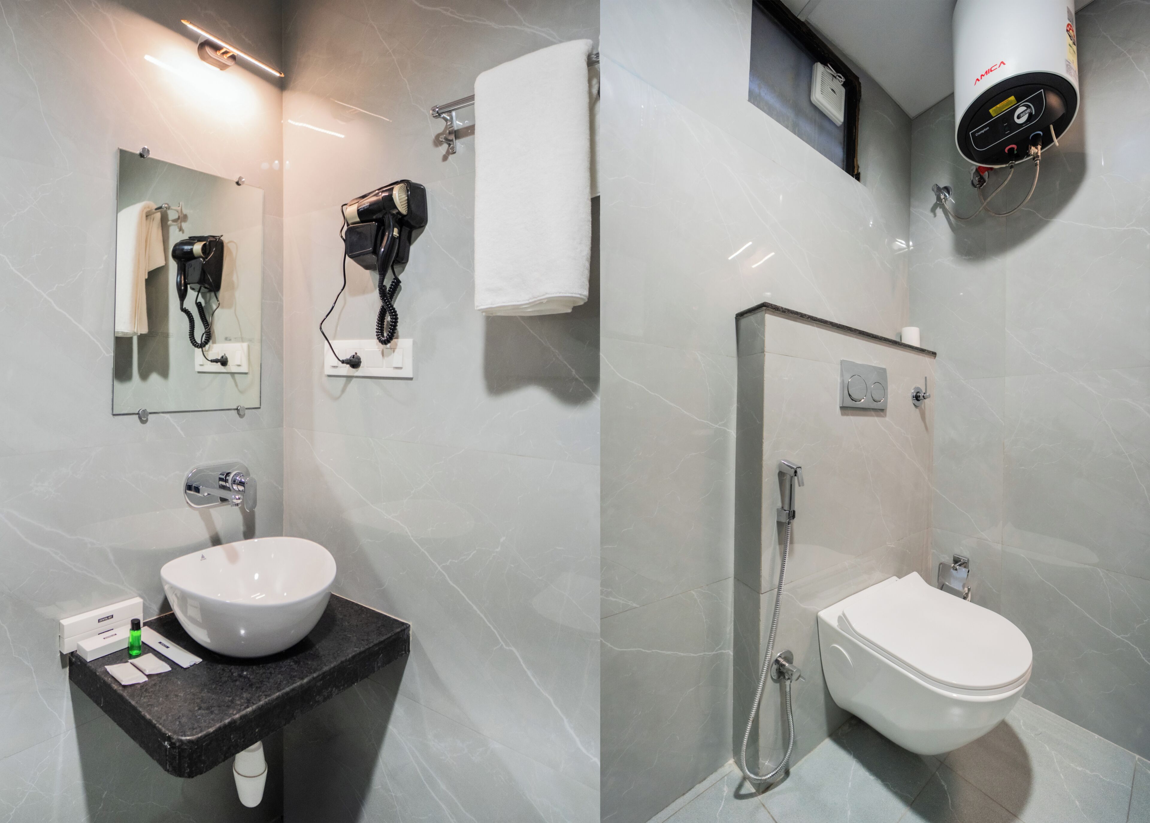 A modern bathroom with a sink, mirror, hairdryer, and shower.