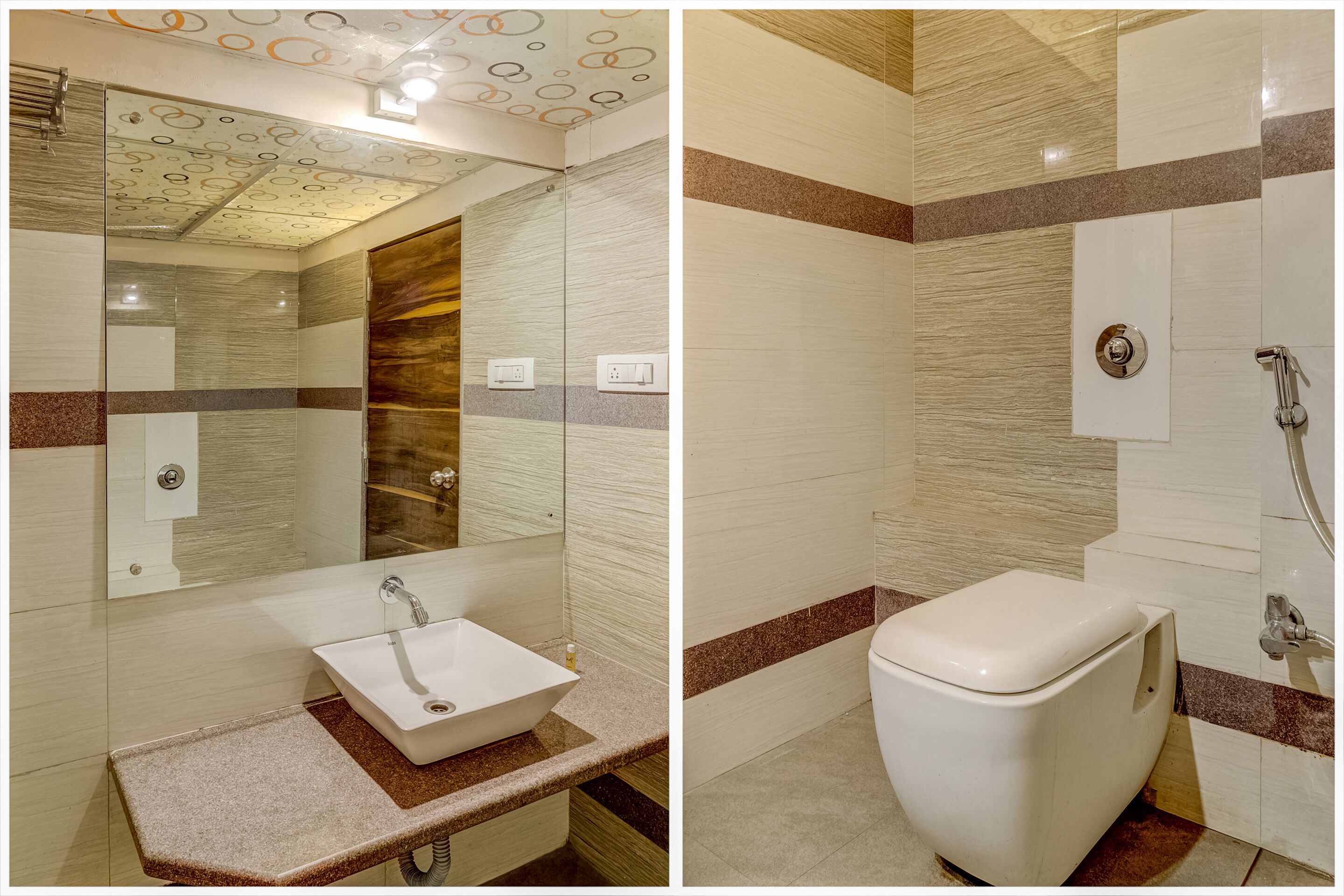 A bathroom with a glass-enclosed shower, a white sink, and a toilet.