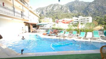 Seasonal outdoor pool, pool umbrellas, sun loungers