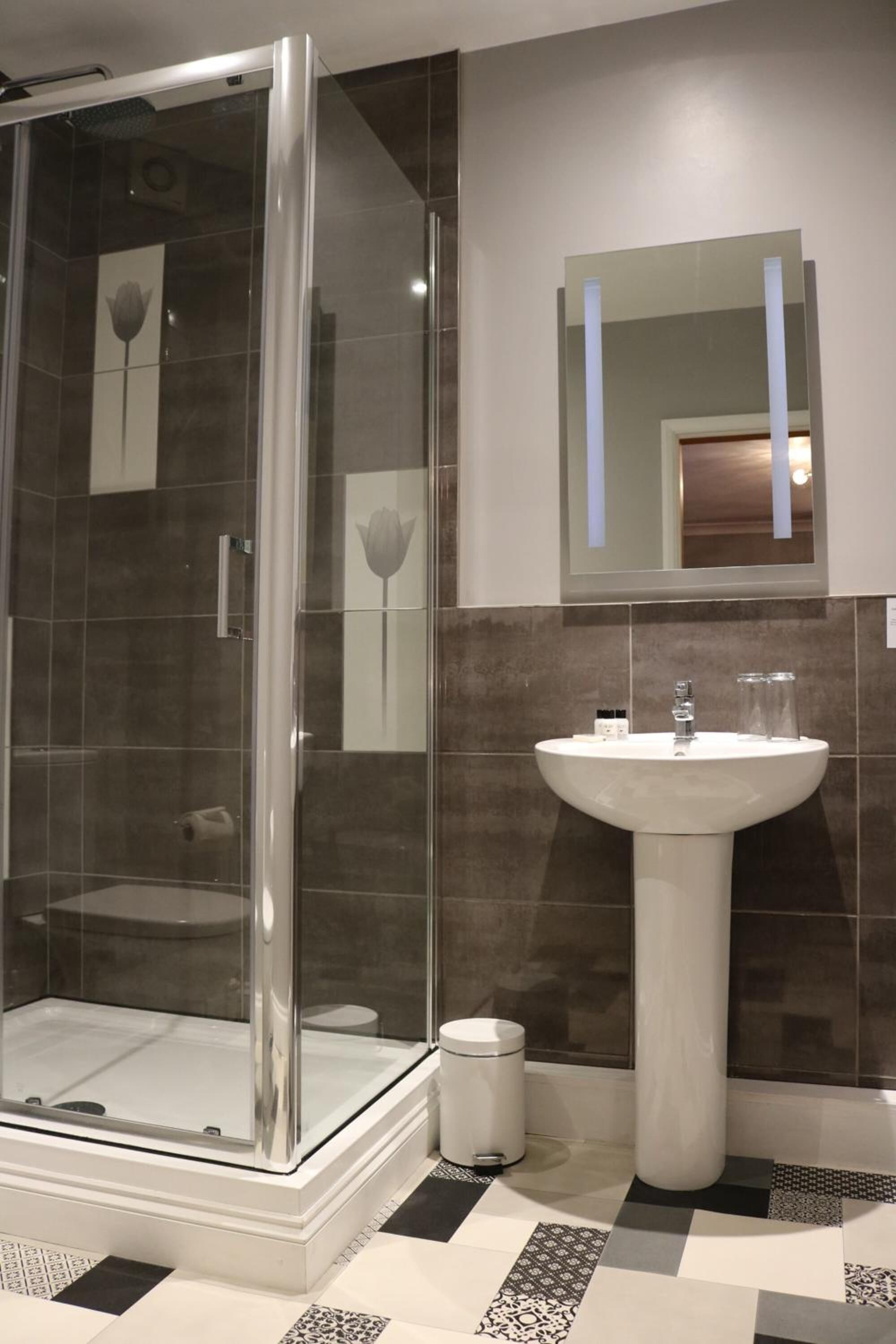Separate tub and shower, free toiletries, hair dryer, heated floors