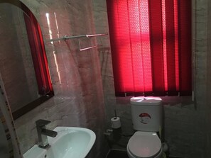 Combined shower/bathtub, deep-soaking bathtub, towels