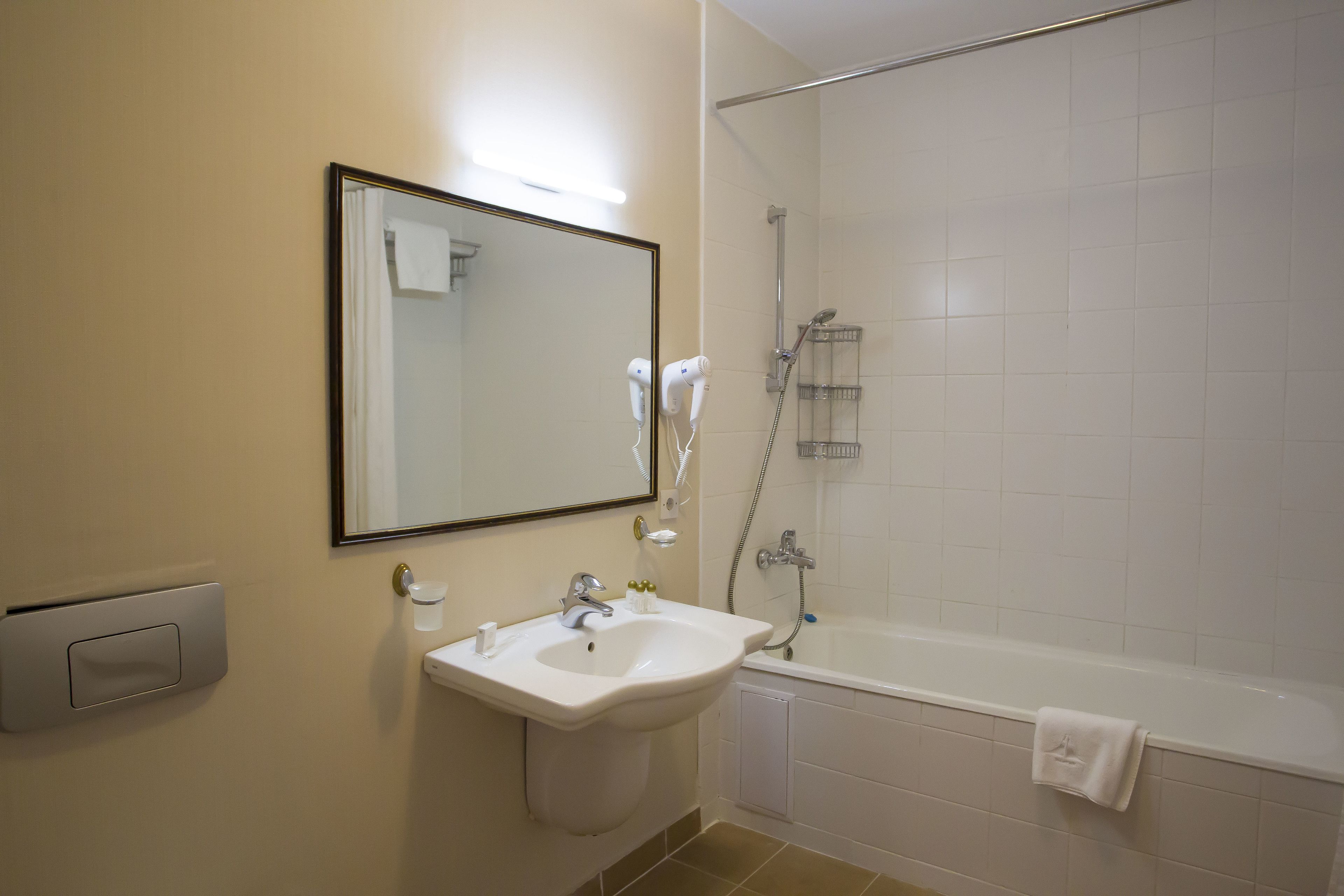 Standard Room, 1 King Bed (Mansarda) | Bathroom | Free toiletries, hair dryer, bathrobes, slippers