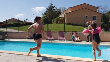 Seasonal outdoor pool, open 11:00 AM to 9:00 PM, pool umbrellas