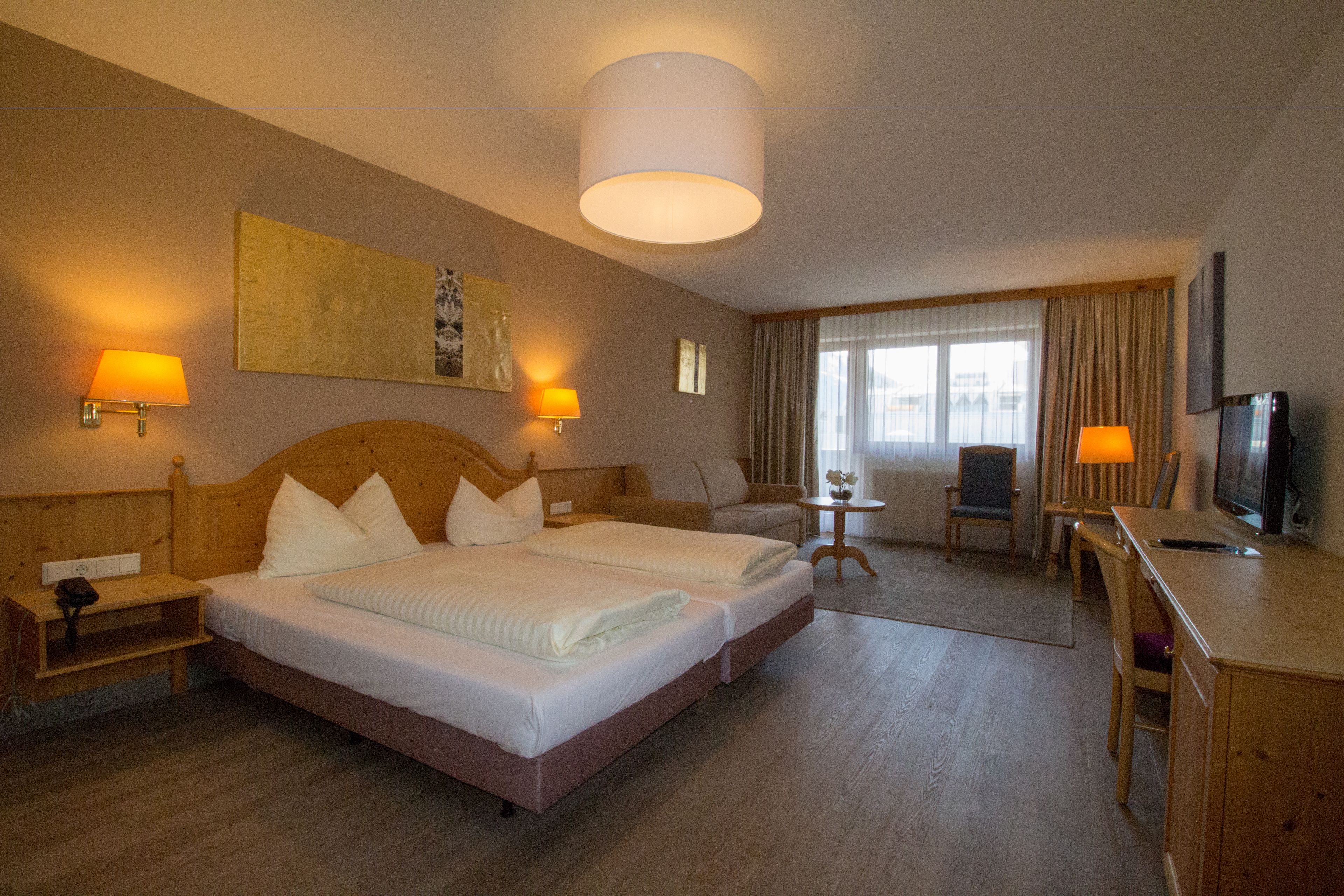 junior suite | in-room safe, desk, blackout curtains, soundproofing