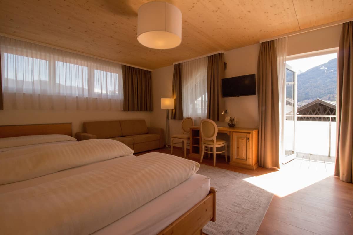 junior suite | in-room safe, desk, blackout curtains, soundproofing