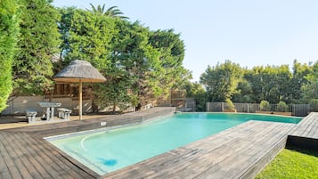 Outdoor pool, pool umbrellas, sun loungers