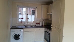 Apartment, 1 Bedroom, Ground Floor | Private kitchen | Fridge, microwave, oven, stovetop