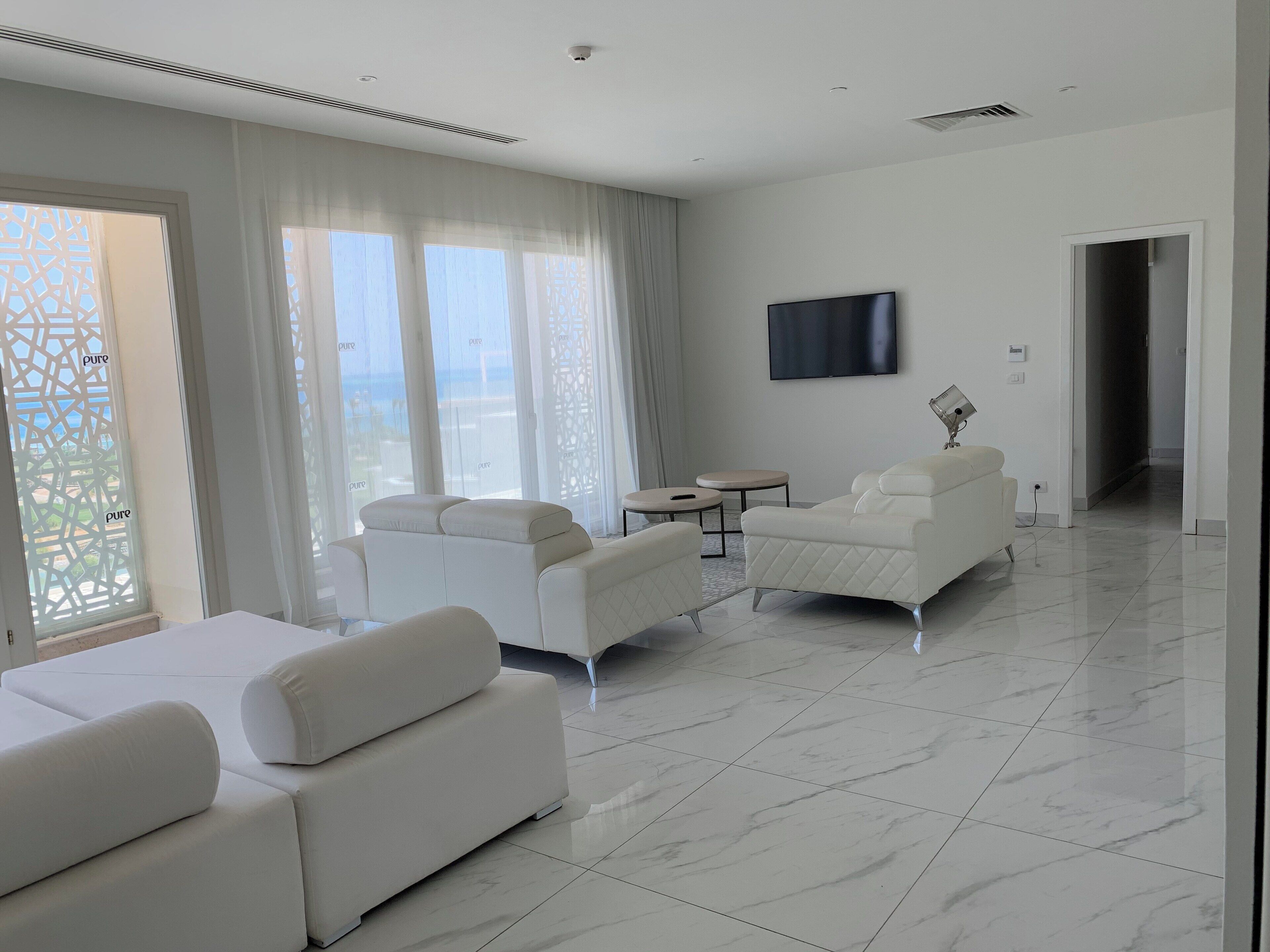 suite (sky suite) | living area | 49-inch flat-screen tv with satellite channels, tv