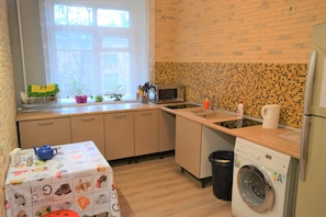 Fridge, microwave, cookware/dishes/utensils