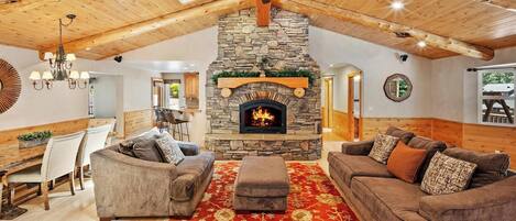 Una televisión, una chimenea, videojuegos, una mesa de tenis de mesa