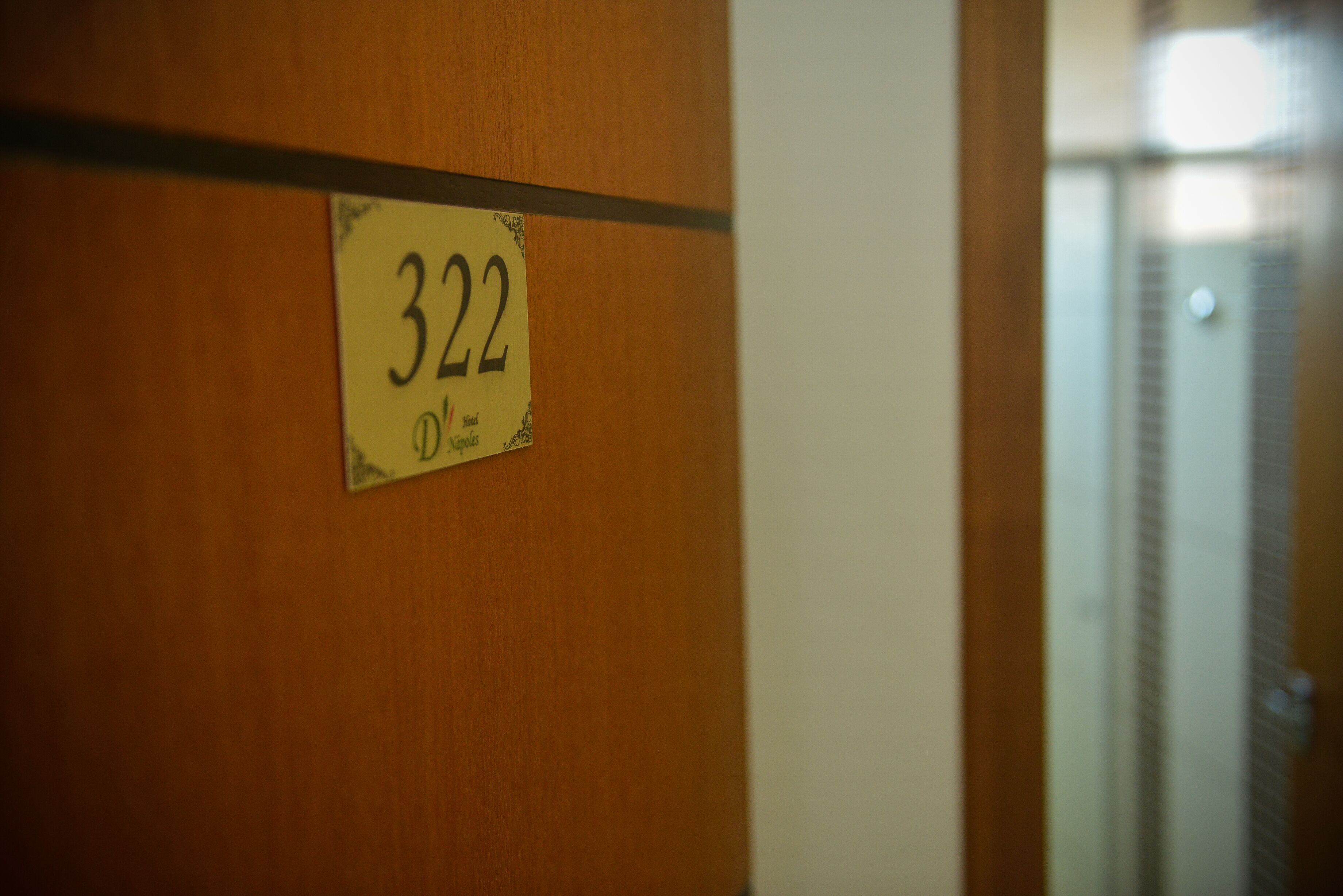 A door with a number sign indicating room 322.