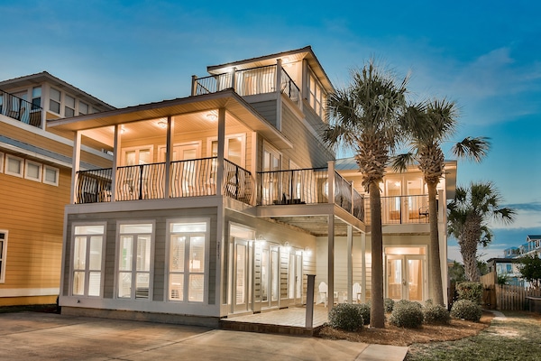 View of front of house with numerous bedrooms/decks with views of Gulf of Mexico