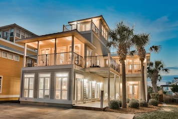 View of front of house with numerous bedrooms/decks with views of Gulf of Mexico