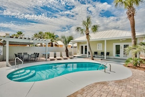A heated pool, sun loungers