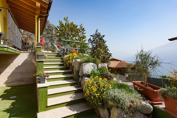 A staircase leading to a building with a view of a mountain.