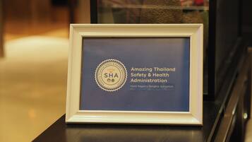 A framed certificate from the Amazing Thailand Safety & Health Administration at the Hyatt Regency Bangkok Sukhumvit.