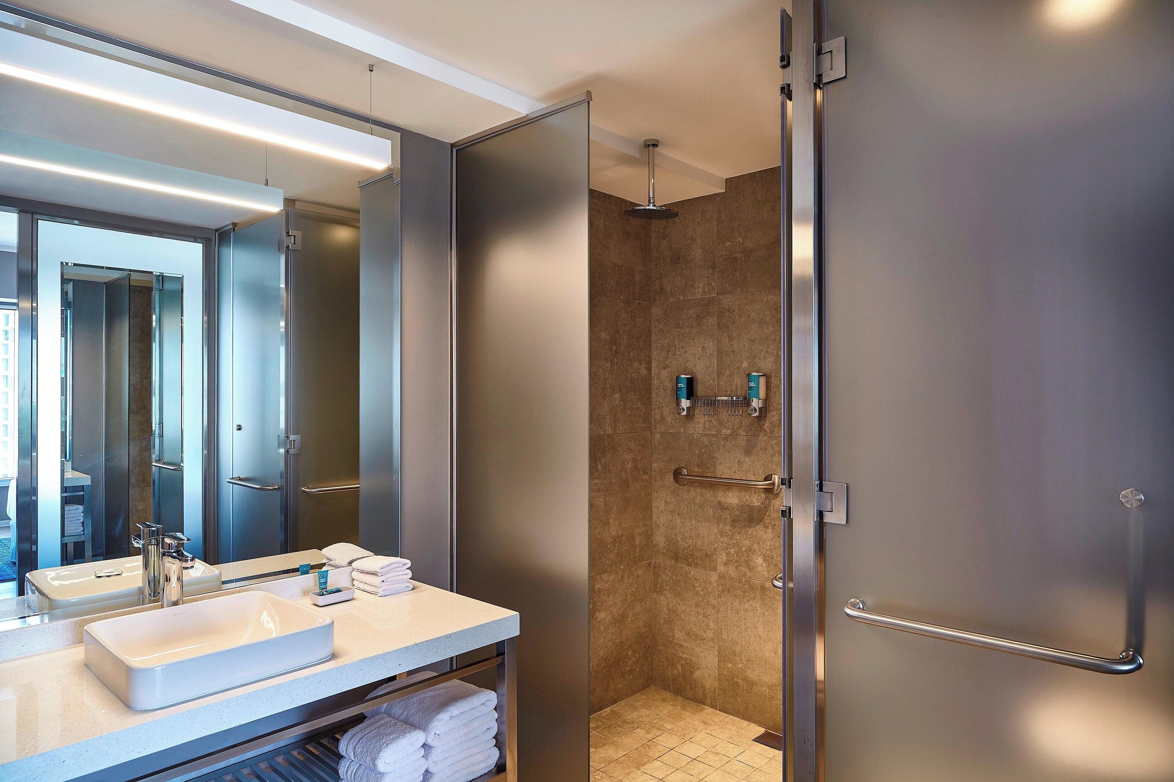 suite, 1 king bed, non smoking, city view (corner) | bathroom | shower, rainfall showerhead, free toiletries, hair dryer