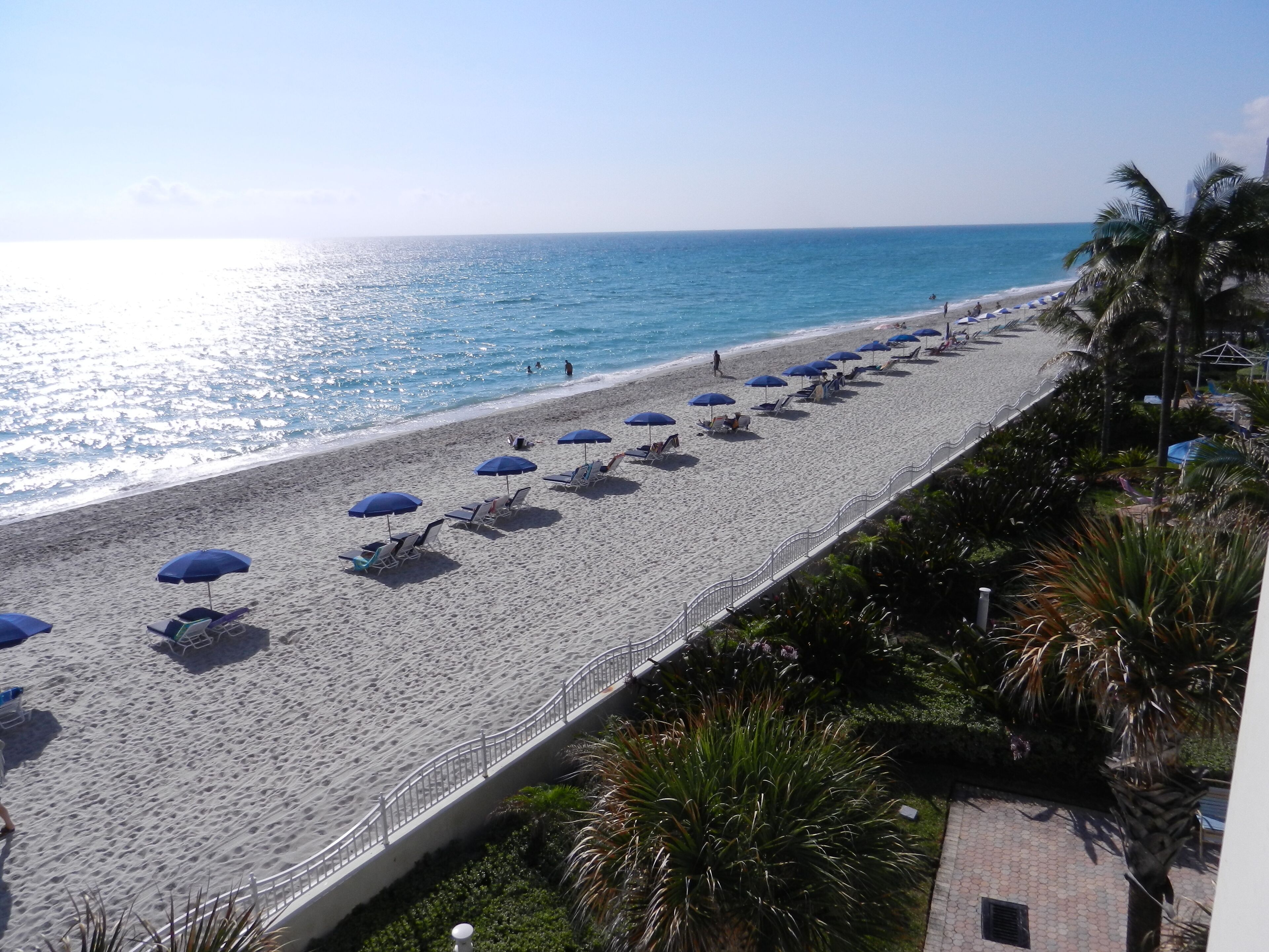 On the beach, sun-loungers, beach towels