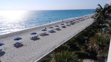 On the beach, sun loungers, beach towels
