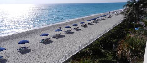 On the beach, sun-loungers, beach towels