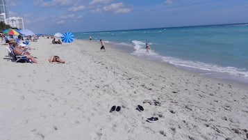 On the beach, sun-loungers, beach towels