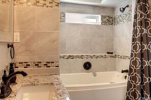 Combined shower/tub, hair dryer, towels, soap