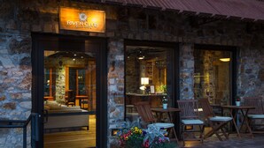 A stone building with a sign reading "River Club." - Luxurious Private Pet-Friendly River Club Residence (Telluride)